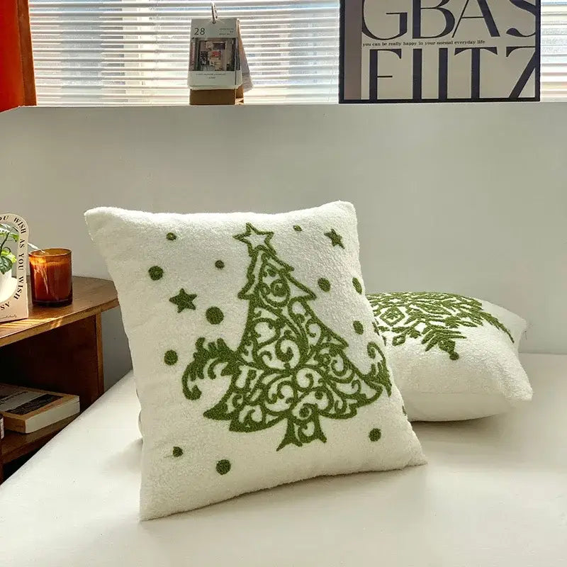 White plush embroidered pillow featuring a green christmas tree design with star accents decorbites christmas cartoon