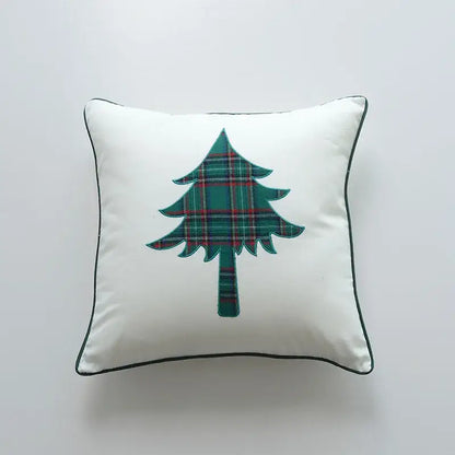 White square pillow cover with green and red plaid christmas tree appliqué and black piping decorbites christmas cartoon