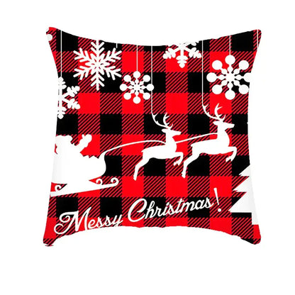 Red and black plaid decorbites christmas cushion cover featuring white snowflakes reindeer santa and messy christmas text