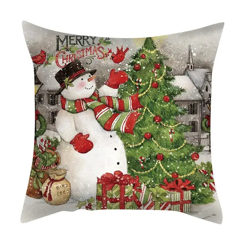 Decorbites christmas cushion cover set featuring a snowman with red green striped scarf decorating tree with candy canes presents birds