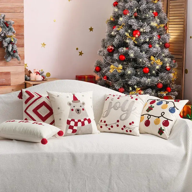 Set of DecorBites Christmas Day embroidered pillowcases with festive designs on cream fabric for living room sofa decor
