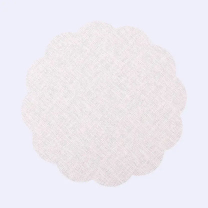 Delicate off-white scalloped fabric doily with subtle woven texture in DecorBites Christmas decor placemat set