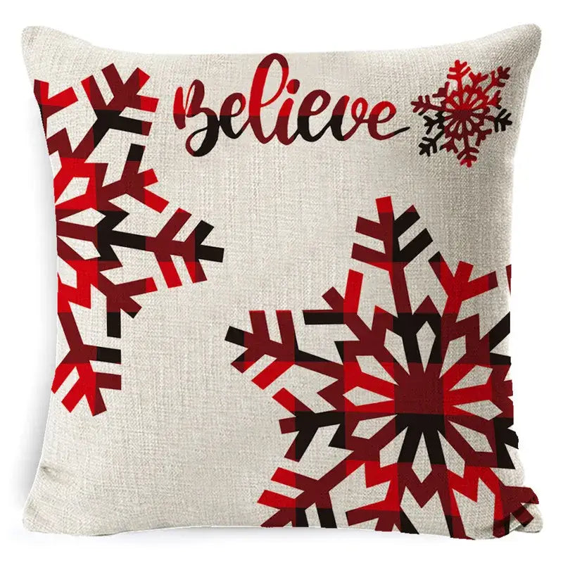 Beige linen pillow cover with bold red and black plaid snowflake design and believe script for decorbites christmas deer