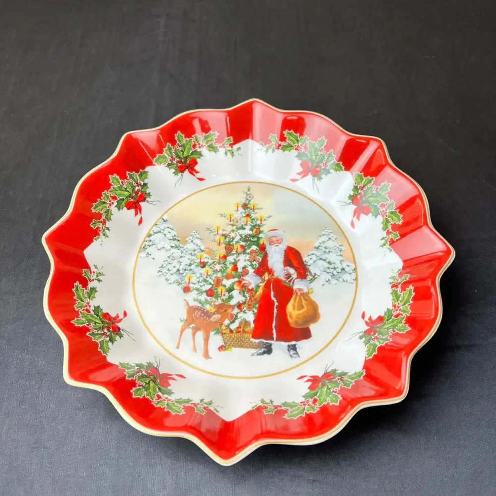 Red and white ceramic christmas bowl with scalloped edge and santa illustration from decorbites christmas dinnerware set