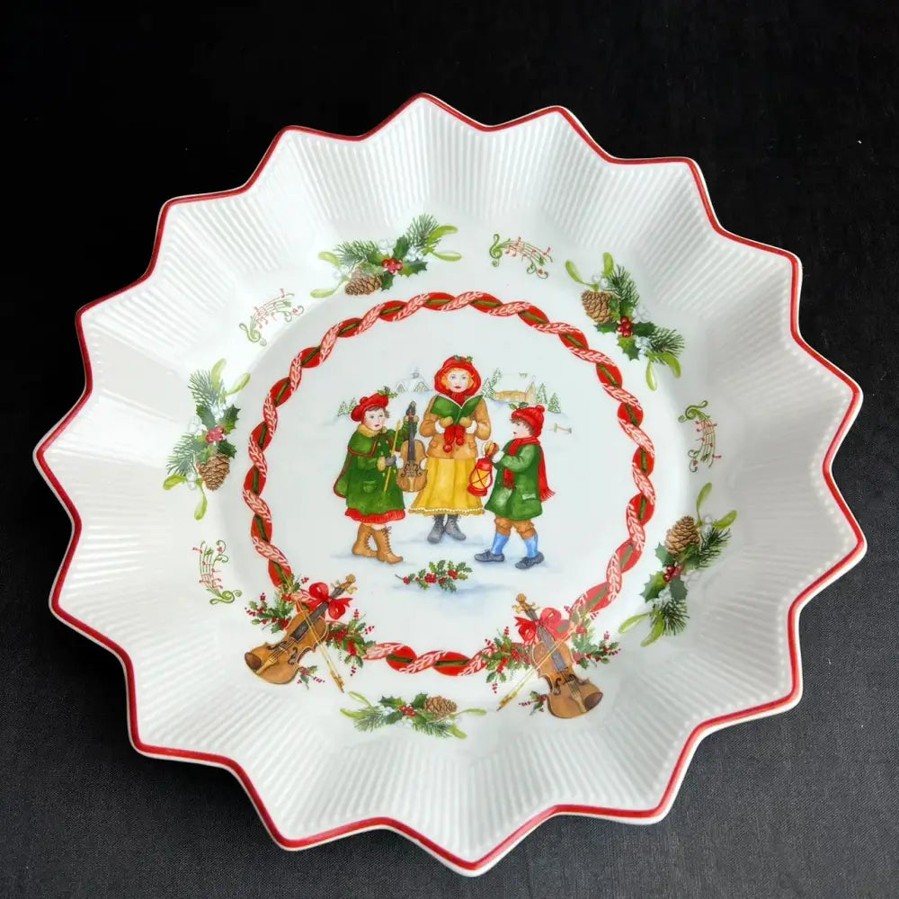 White ceramic pie plate with scalloped edge red trim and holiday illustration from decorbites christmas dinnerware set