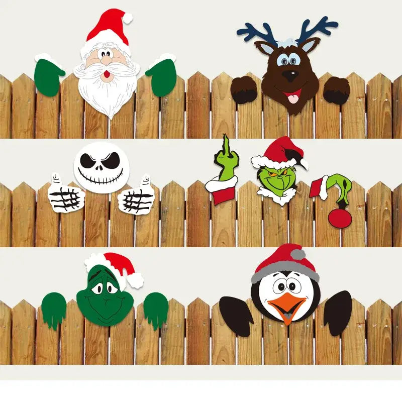 Wooden fence decorated with decorbites christmas door frame set featuring festive santa reindeer and cartoon character cutouts
