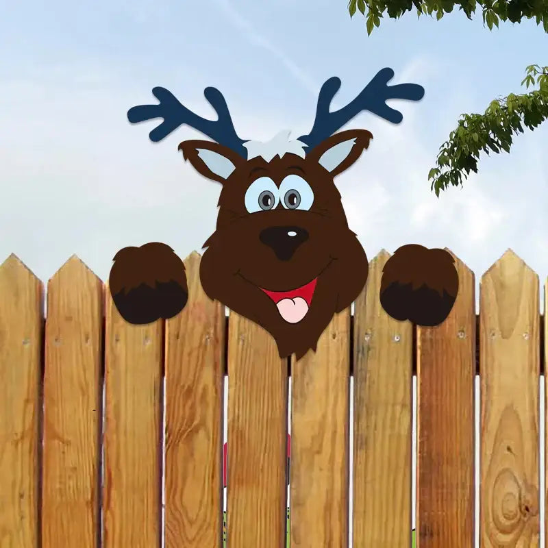 A cheerful brown reindeer with blue antlers peeking over a wooden fence in decorbites christmas door frame decor set