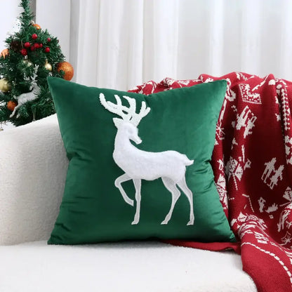 Deep green velvet pillow cover with white embroidered christmas elk design by DecorBites for festive decor
