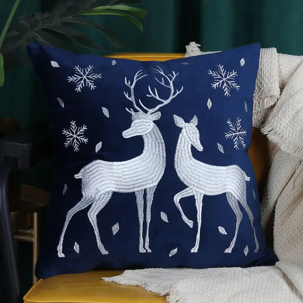 Navy blue pillow cover featuring embroidered white christmas elk and snowflakes by decorbites christmas elk 45x45cm