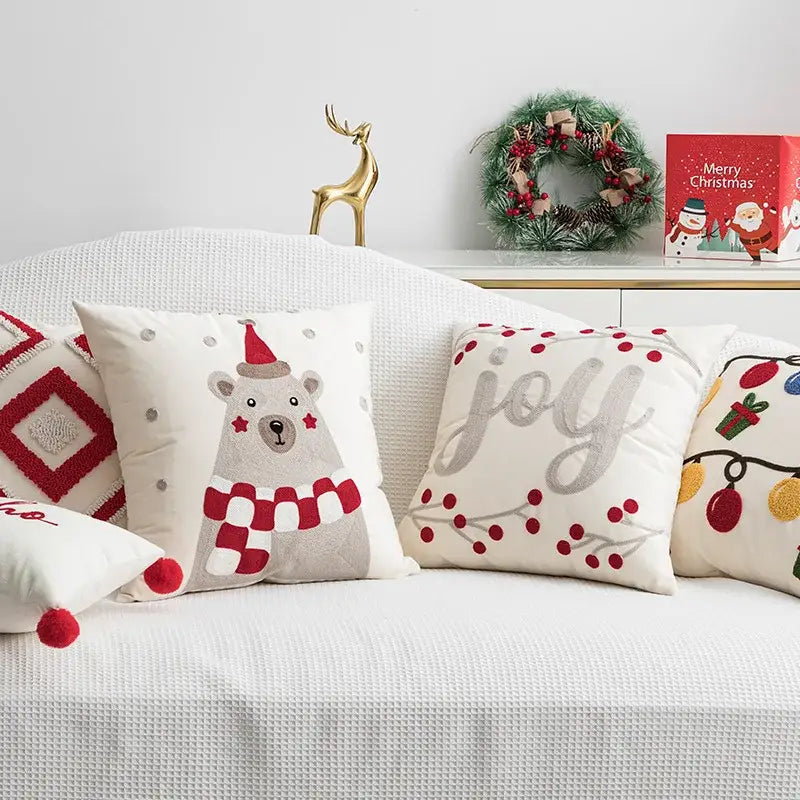 White christmas embroidered red cushion cover by decorbites featuring festive polar bear joy and lights designs