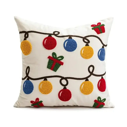 White pillow cover featuring decorbites christmas embroidered design with red geometric pattern and colorful christmas lights