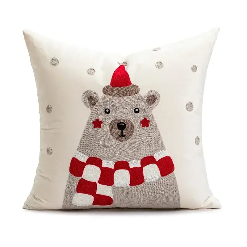 Cream-colored pillow cover featuring decorbites christmas embroidered bear with red santa hat and silver sequin snowflakes