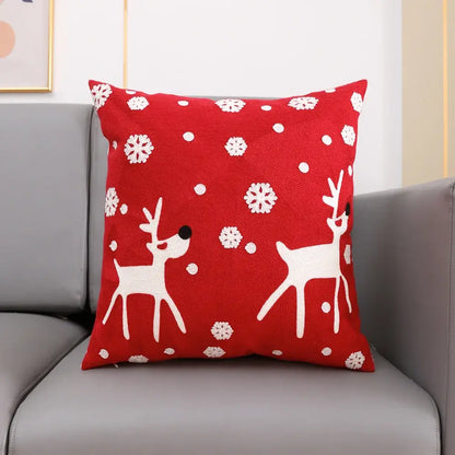 Red cushion cover with white embroidered reindeer and snowflakes from decorbites christmas embroidery collection cotton square pillowcase