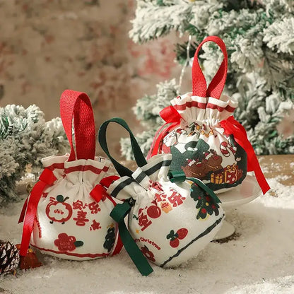 White fabric decorbites christmas eve apple bags with festive prints and red or green ribbons for santa candy gifts