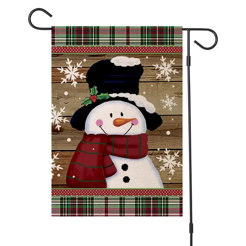 A decorbites christmas festive garden flag featuring a cheerful snowman with top hat and red striped scarf on wood