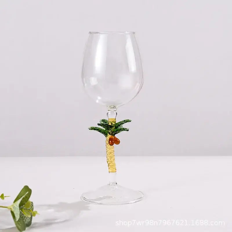 DecorBites™ glass goblet set featuring clear glass goblets with decorative palm tree design for festive cocktail use