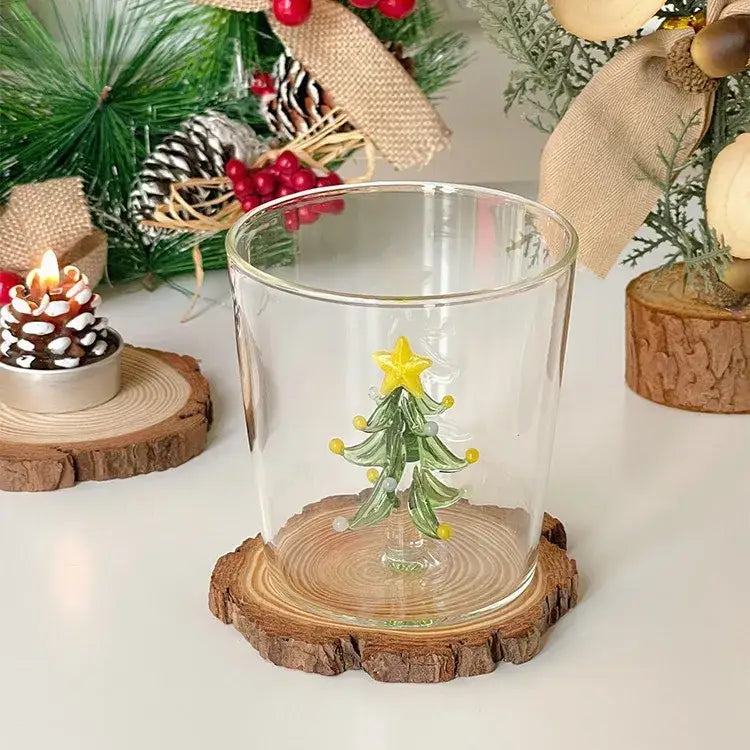 Decorbites™ christmas glass goblet set featuring clear glass with a hand-blown green tree on a rustic wood slice base