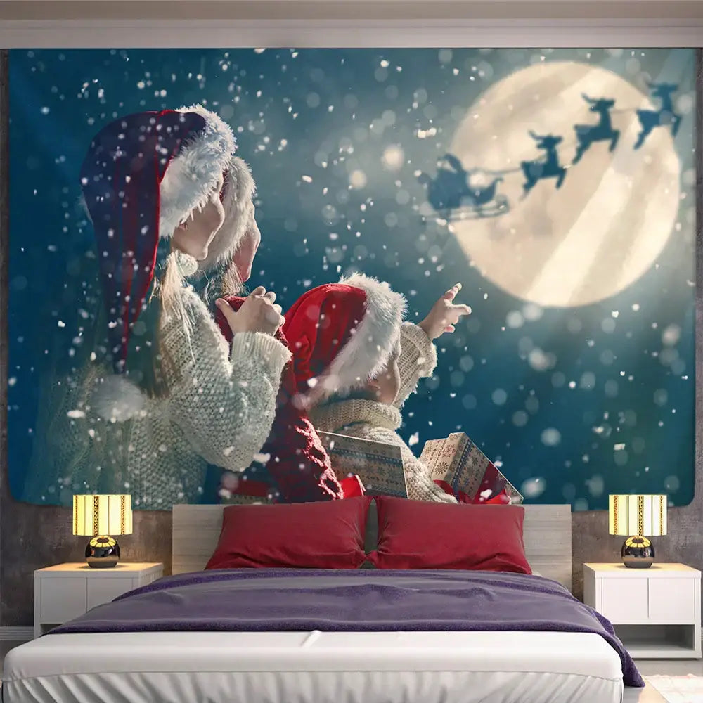 Decorbites christmas god deer tapestry featuring a mother and child in festive hats gazing at santa sleigh at night