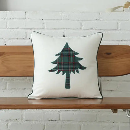 White cushion with green plaid christmas tree and black trim from decorbites christmas letter embroidery set