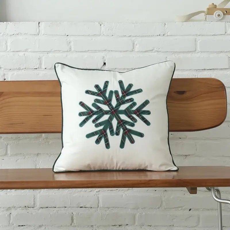 White cushion with green plaid snowflake design and black trim from decorbites christmas letter embroidery plaid set