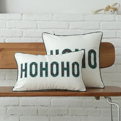 White rectangular pillow with green plaid hohoo embroidery and black piping from decorbites christmas letter set