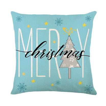 Light blue linen pillow cover with decorbites christmas letter print featuring festive tree and merry christmas text