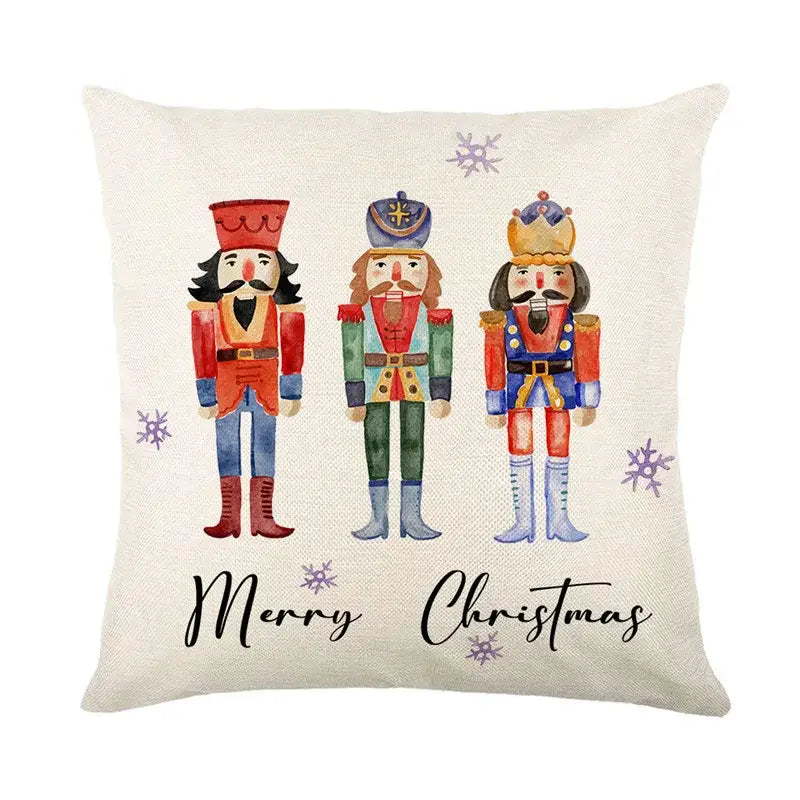 Cream-colored linen pillow cover with christmas letter print featuring nutcrackers and merry christmas script by decorbites christmas letter