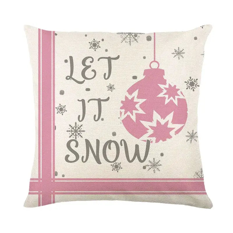 Cream-colored linen pillow cover with pink festive christmas letter print and let it snow design by decorbites christmas letter