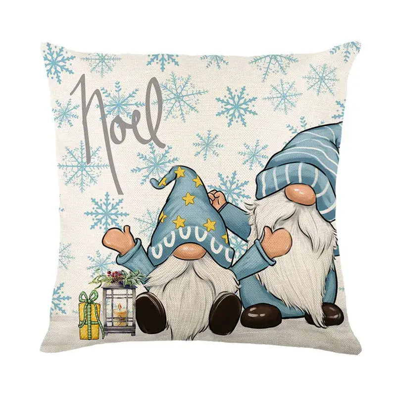 Beige linen pillow cover featuring decorbites christmas letter print with two blue gnomes and noel text for holiday decor
