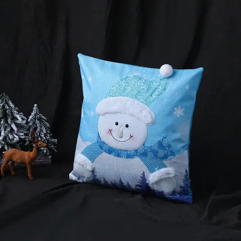 Blue snowman-themed pillow cover with white fur trim embroidered snowflake detail and fluffy pom-pom by DecorBites Christmas Patchwork