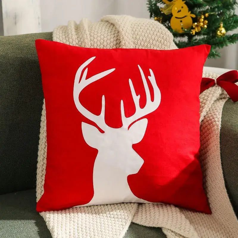 Red square velvet cushion cover featuring a white deer silhouette from decorbites christmas patchwork merrychristmas collection