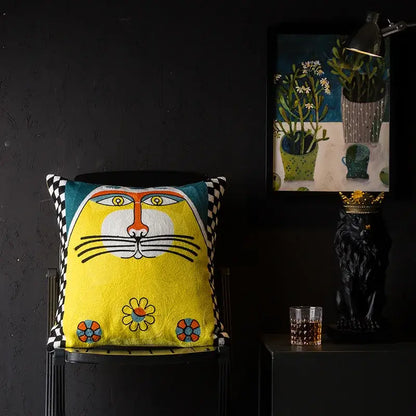 Bright yellow DecorBites Christmas Picasso style cushion cover with embroidered cat face and floral motifs for sofa and bed
