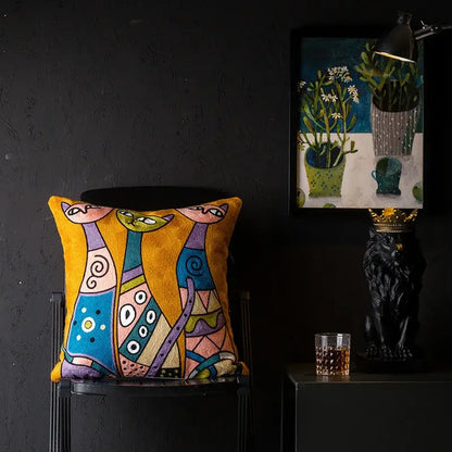 Vibrant yellow cushion cover with embroidered abstract cats in colorful geometric patterns decorbites christmas picasso style