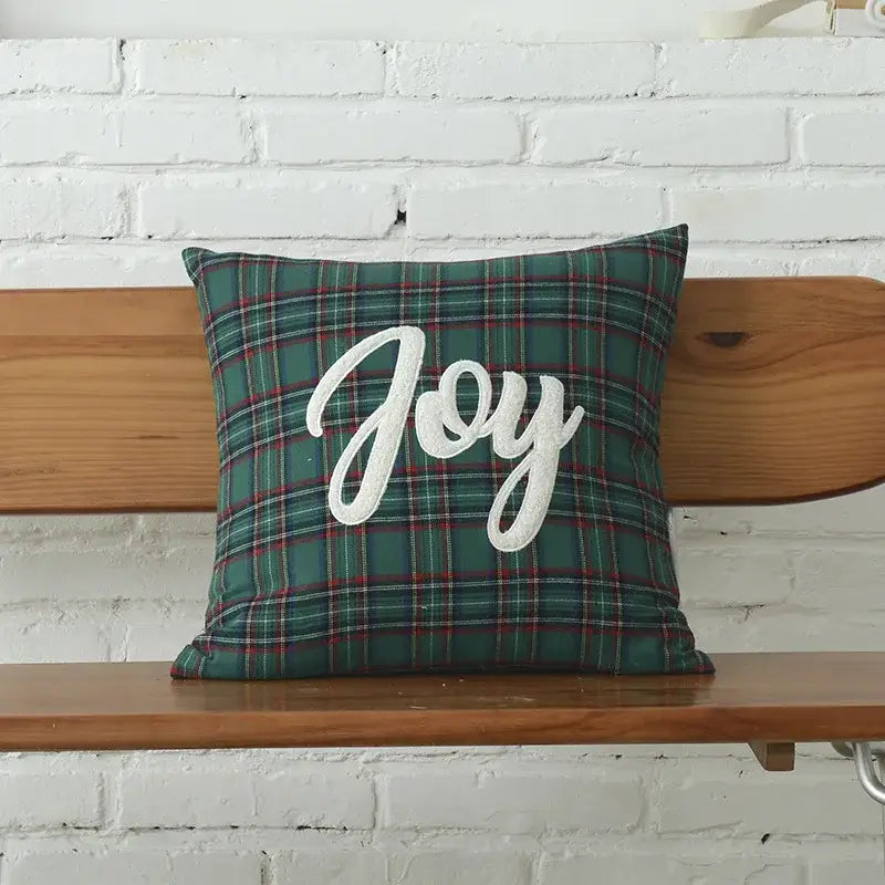 Green plaid cotton cushion cover with white embroidered joy lettering from decorbites christmas plaid collection