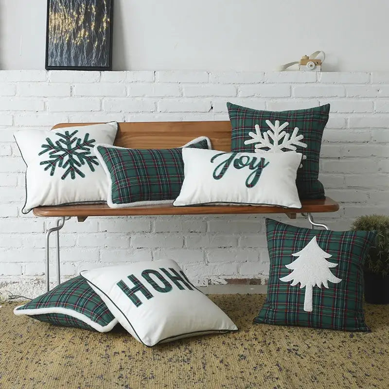 Set of DecorBites Christmas plaid cotton cushion covers in green and white with embroidered snowflakes and holiday text