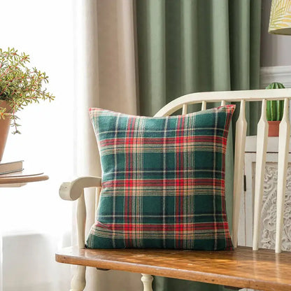 A cozy decorbites christmas plaid cushion cover in deep green red and beige tones perfect for festive holiday decor