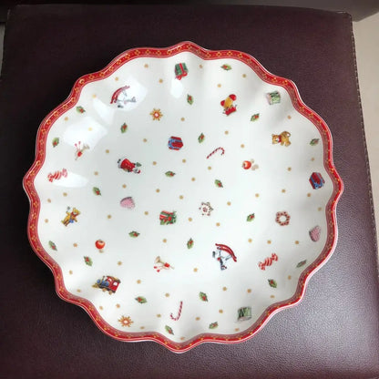Festive white ceramic serving dish with scalloped red rim and colorful christmas illustrations from DecorBites Christmas porcelain tableware set