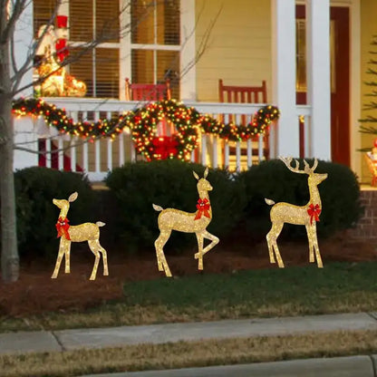 Three golden glittery led light outdoor decor reindeer with red bows by decorbites christmas reindeer elk sculpture