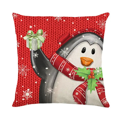 Red knitted-textured DecorBites Christmas santa pillow cover featuring a festive penguin holding a gift for sofa decor