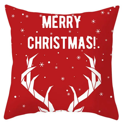 Red christmas-themed pillow cover with white merry christmas text and stylized reindeer antlers for decorbites christmas santa collection