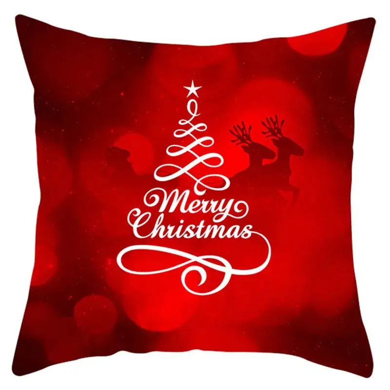 Red christmas-themed pillow cover with white merry christmas design and santa claus reindeer silhouettes by decorbites christmas santa