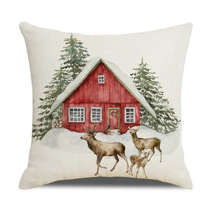 Beige linen pillow cover featuring decorbites christmas snow elk design with red cabin and deer in snowy landscape