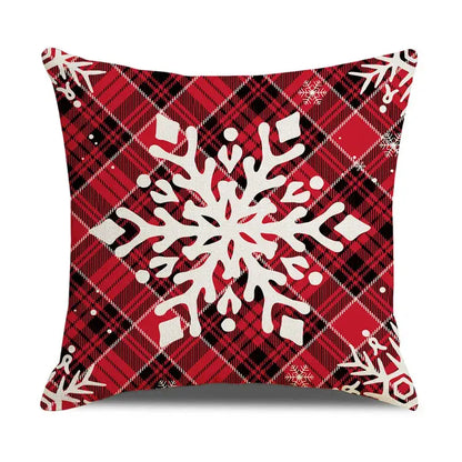 Red and black plaid pillow cover with large white snowflake design from decorbites christmas snow elk collection