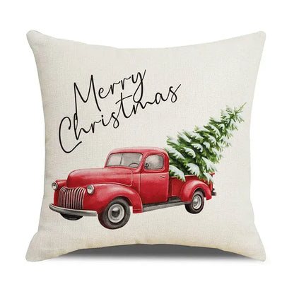 Cream-colored linen pillow cover with vintage red truck and snow-dusted tree from decorbites christmas snow elk collection