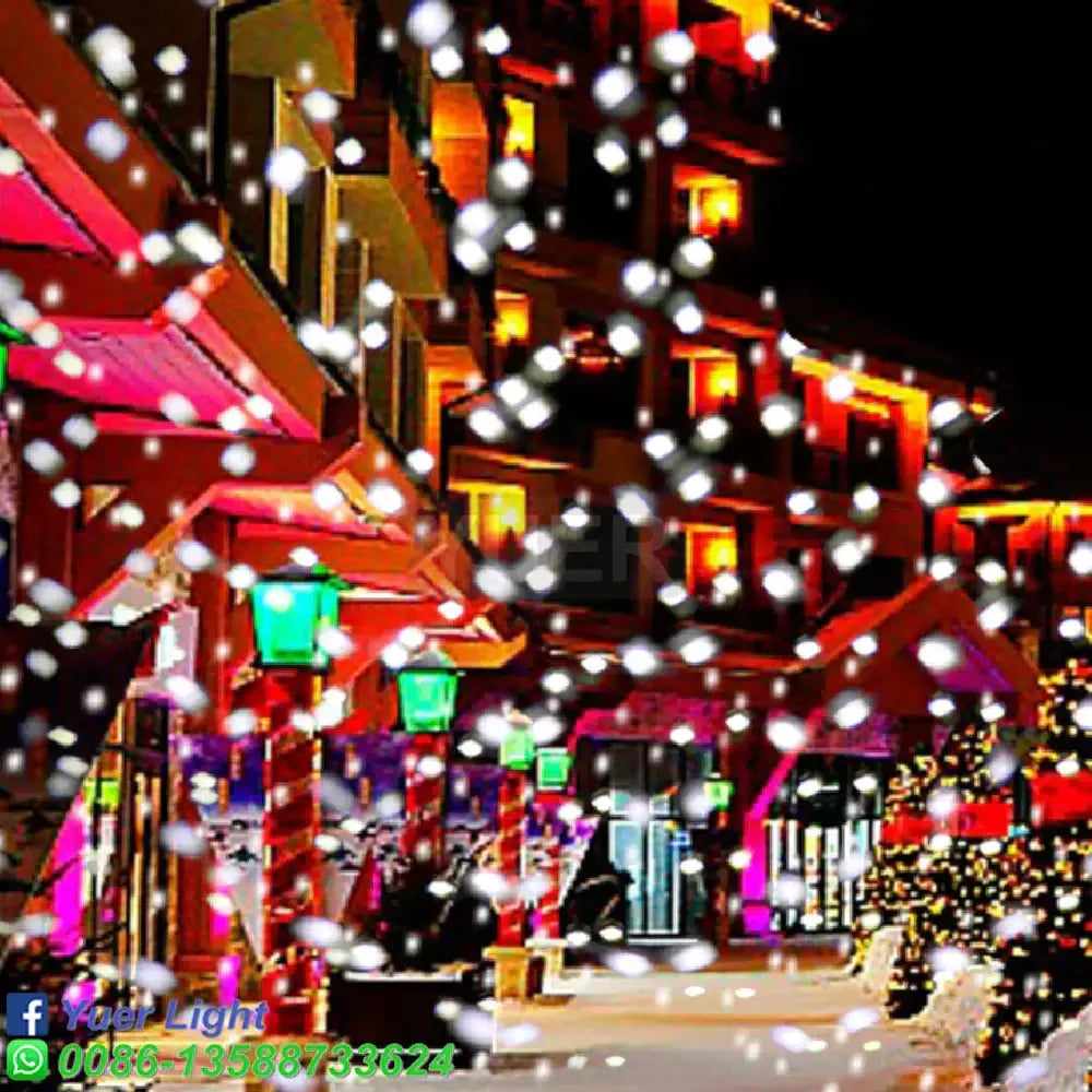 String of white led decorbites christmas snow projector lights hanging in festive street for indoor outdoor use