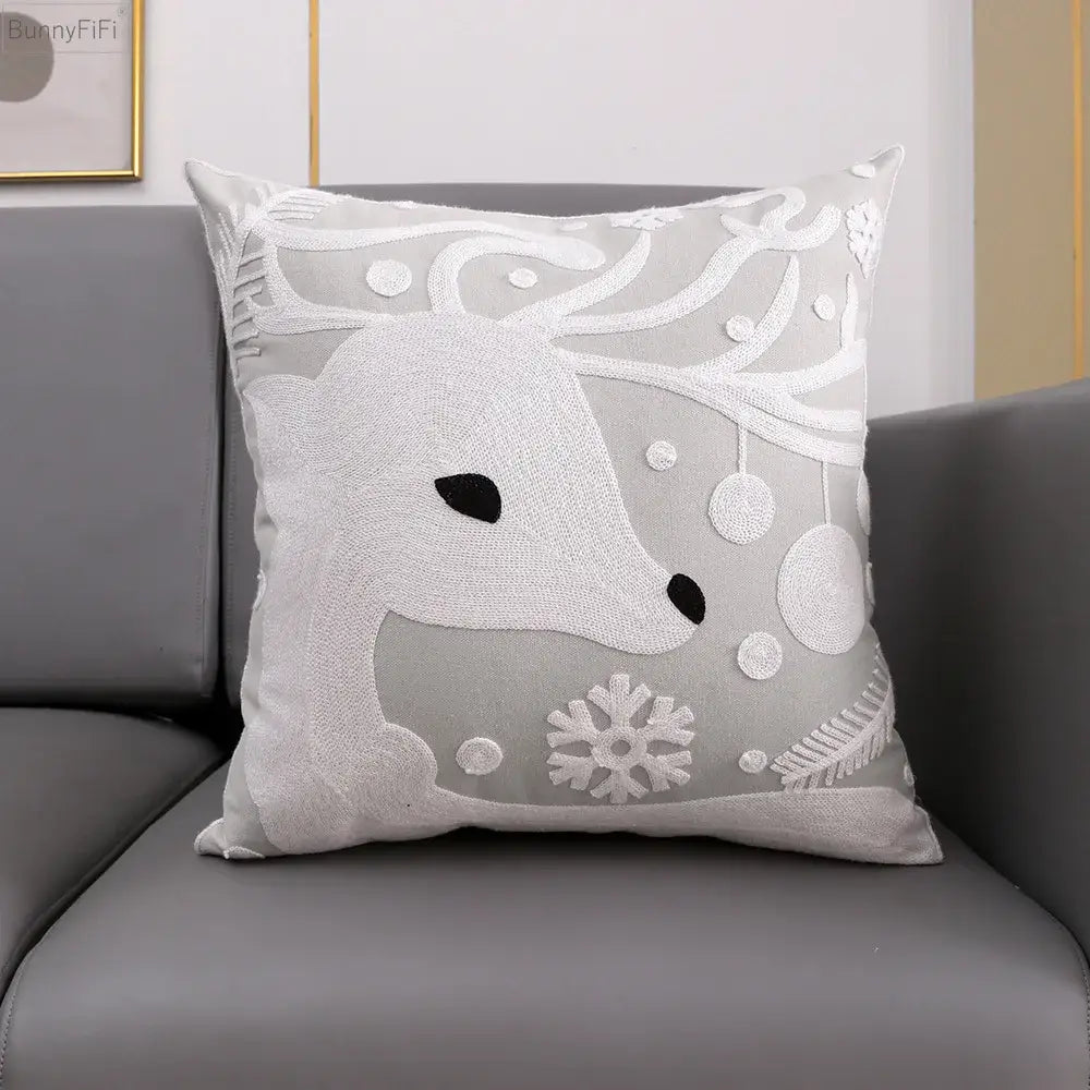 Gray cushion cover featuring embroidered white snowflake deer and ornaments from decorbites christmas snowflake collection