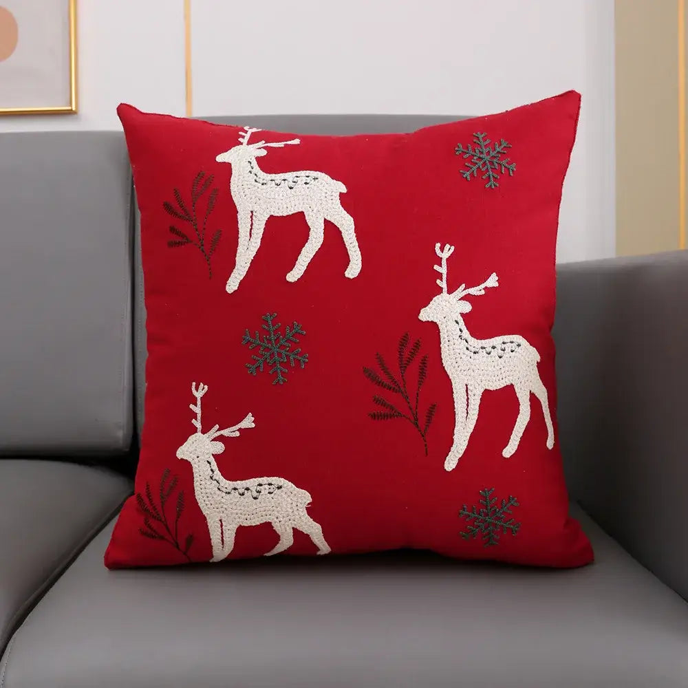 Red cushion cover with embroidered white snowflake deer design from decorbites christmas snowflake collection