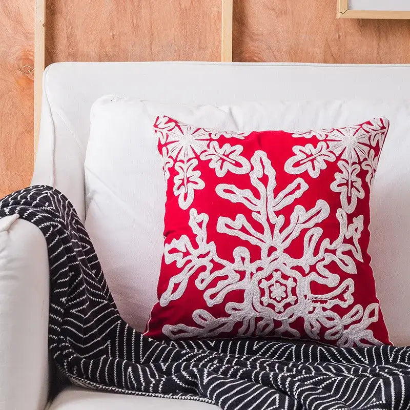 Vibrant red decorbites christmas snowflake pillowcase with intricate white embroidered floral and snowflake elk patterns
