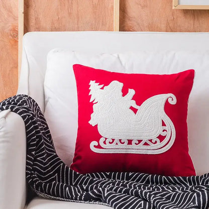 Red square pillow with white embroidered sleigh design from decorbites christmas snowflake elk collection