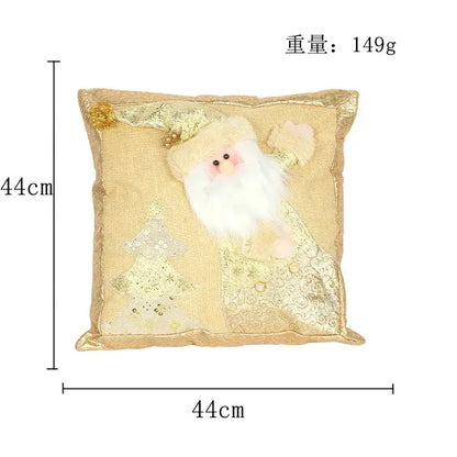 A plush gold embroidered pillowcase featuring a three-dimensional santa claus with sequined trees and gold embellishments